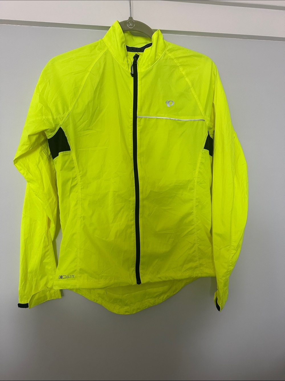 Pearl Izumi women’s High-Visibility Neon Yellow Cycling Windbreaker. Never worn